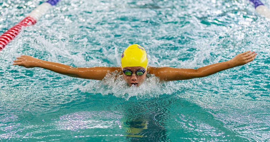 Frances Empinado swims a leg for the Wildcat medley relay team. (Photo by John Fisken)