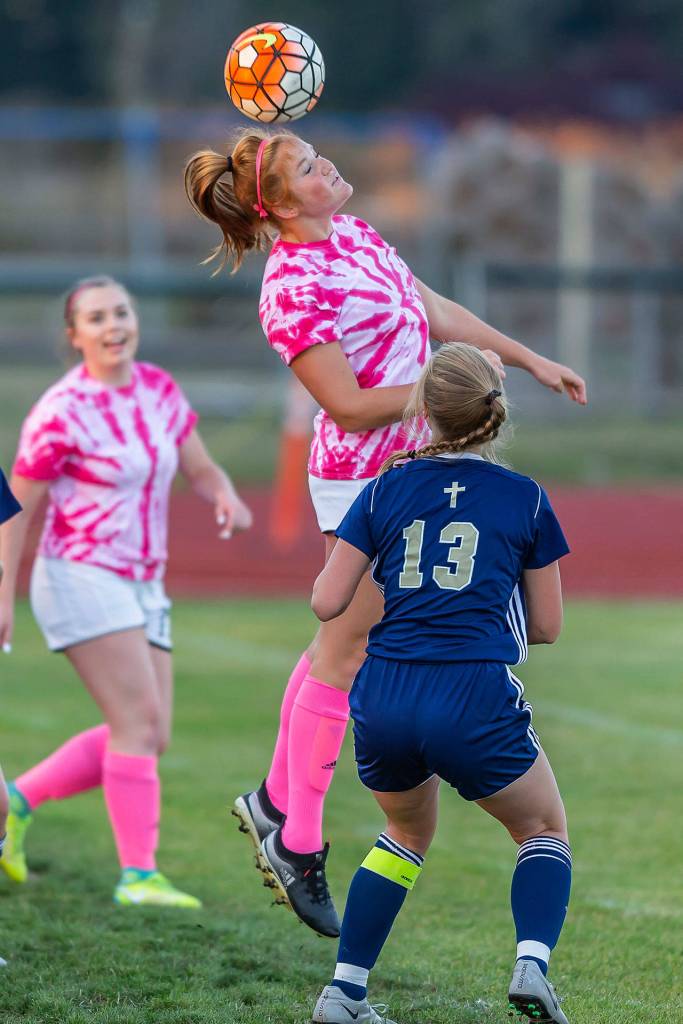 Ema Smith advances the ball with a header.(Photo by John Fisken)