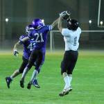 Sean Toomey-Stout (1) snags the ball from South Whibeys Billy Rankin (21) and takes the ball in for a touchdown. (Photo by Steve Smith)