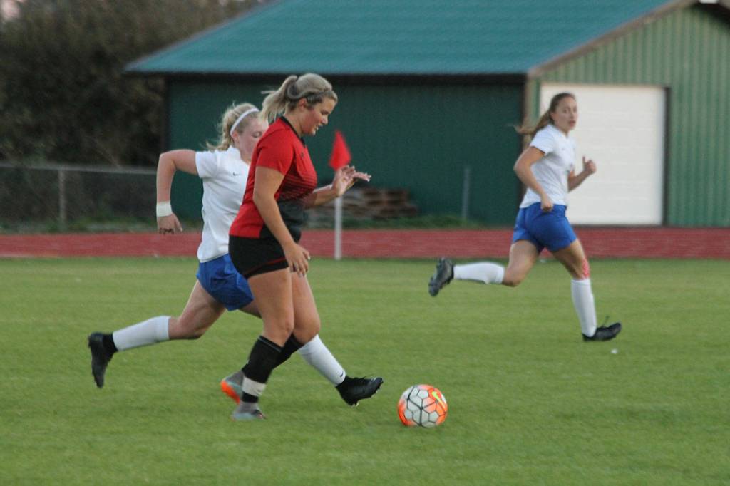Genna Wright pushes the ball up the field for the Wolves.(Photo by Jim Waller/Whidbey News-Times)