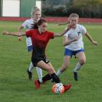 Coupevilles Mallory Kortuem beats two Falcons to the ball in Mondays match.(Photo by Jim Waller/Whidbey News-Times)