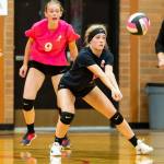 Emma Mathusek passes for the Wolves as Chelsea Prescott, back, gives instructions.(Photo by John Fisken)
