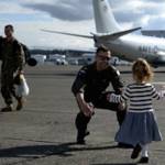 Navy photo                                Lt.Cmdr. John Bartis, a pilot assigned to the Skinny Dragons of Patrol Squadron, reunites with his daughter following a seven-month deployment in the U.S. 7th Fleet area of responsibility. VP-4 returned to Whidbey last Thursday. Story on page A6.
