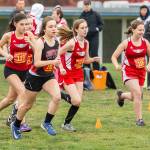 Coupevilles Alana Mihill (black jersey) runs with a group of Kings girls in Saturdays North Sound Conference Championships Saturday.(Photo by John Fisken)