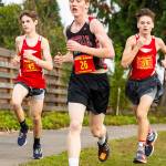Sam Wynn leads a couple of Kings runners during the boys varsity race Saturday.(Photo by John Fisken)