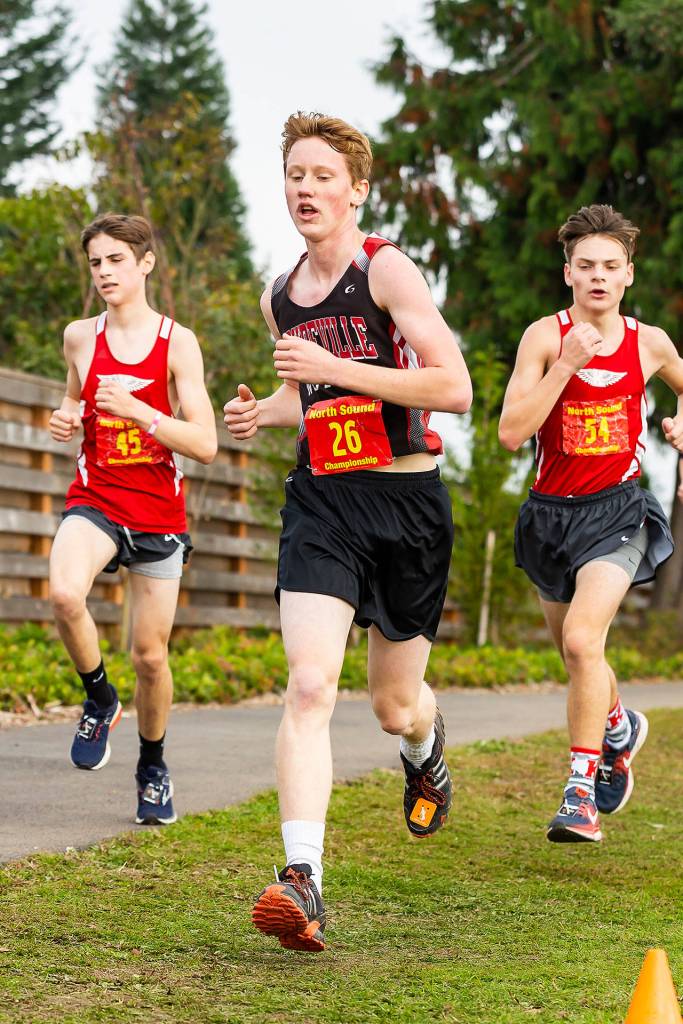 Sam Wynn leads a couple of Kings runners during the boys varsity race Saturday.(Photo by John Fisken)