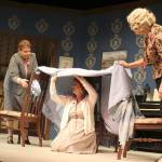 Becky LeMay, center, playing youngest sister, Betsy, wants to make a house out of blankets like the old days. Playing two older siblings, Lisa Judd, left, and Ingrid Schwalbe, right, try and encourage her to go home instead. Directed by Kevin Wm. Meyer, produced by Eric George.