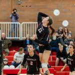 Emma Smith hits against Sultan as Scout Smith (2) and Ashley Menges (14) look on.(Photo by John Fisken)