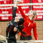 Scout Smith challenges Kings Ava Mason (1) for a ball just above the net.(Photo by John Fisken)