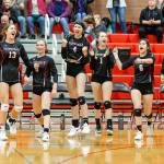 Coupeville celebrates their first-game win over Kings Tuesday. From the left are Emma Smith (13), Lucy Sandahl, Maddie Vondrak, Zoe Trujillo, Raven Vick and Willow Vick. (Photo by John Fisken)