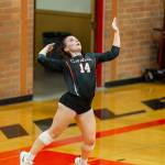 Ashley Menges launches a serve Wednesday.(Photo by John Fisken)