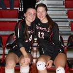 Coupeville seniors Ashley Mengers, left, and Emma Smith embrace before playing their final home match Wednesday.(Photo by John Fisken)