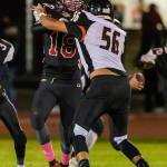 Coupevilles Cam Dahl blocks Granite Falls Carson Thompson in Thursdays game. (Photo by John Fisken)