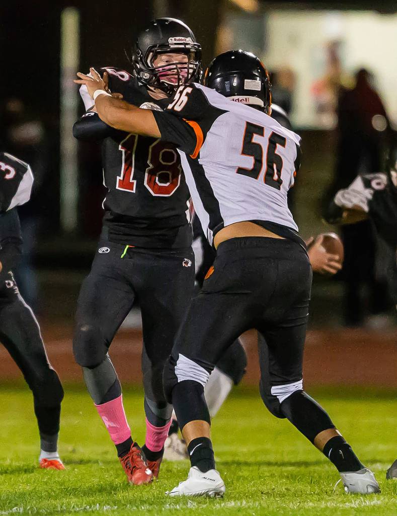 Coupevilles Cam Dahl blocks Granite Falls Carson Thompson in Thursdays game. (Photo by John Fisken)