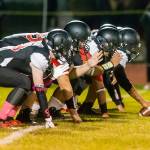 The Coupeville offensive line gets ready to fire off the ball.