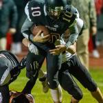 Shane Losey fights for extra yardage.(Photo by John Fisken)