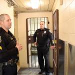 Photo by Jessie Stensland / Whidbey News-Times                                Brian Braunstein, the jail sergeant, and Oak Harbor Police Chief Kevin Dresker, at right, talk in the cramped space of the city jail.