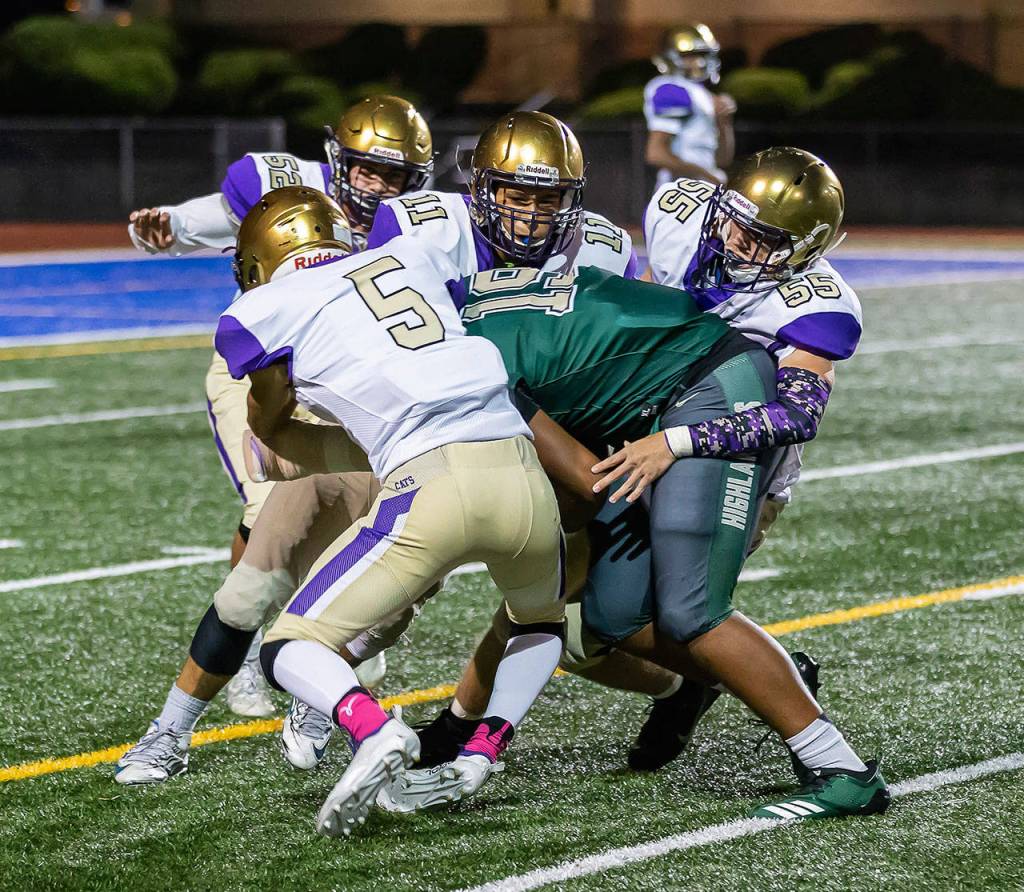 Shingo Johnston (5), Aaron Martinez (11), Ethan Pace (55), Michael Gomez (52).(Photo by John Fisken)
