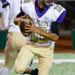 Caleb Fitzgerald looks for an open receiver.(Photo by John Fisken)