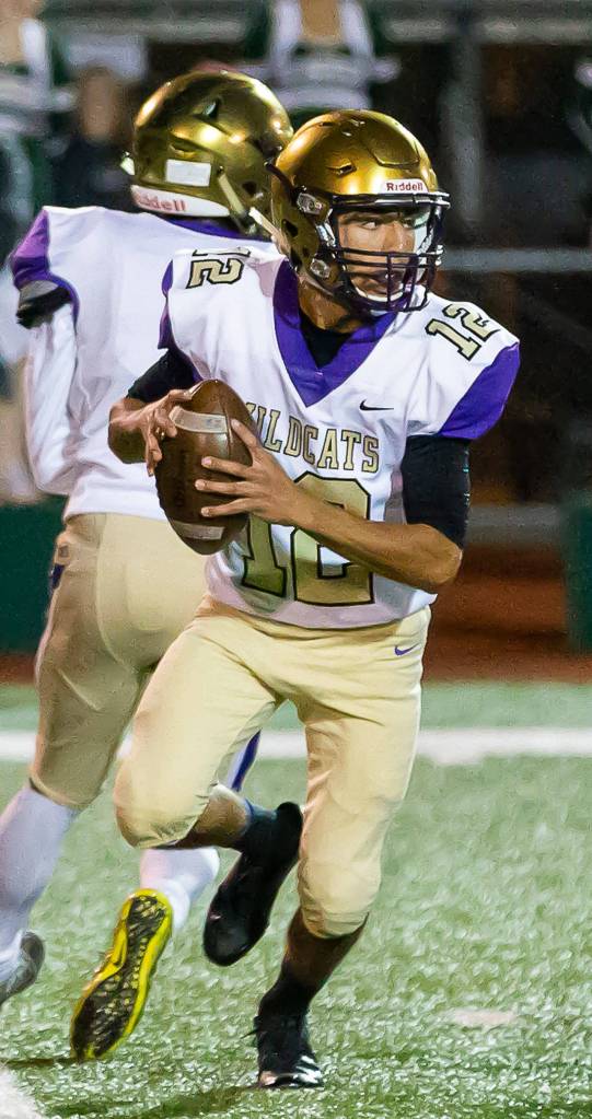 Caleb Fitzgerald looks for an open receiver.(Photo by John Fisken)