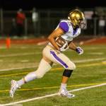 Aaron Martinez returns a kickoff for Oak Harbor.(Photo by John Fisken)