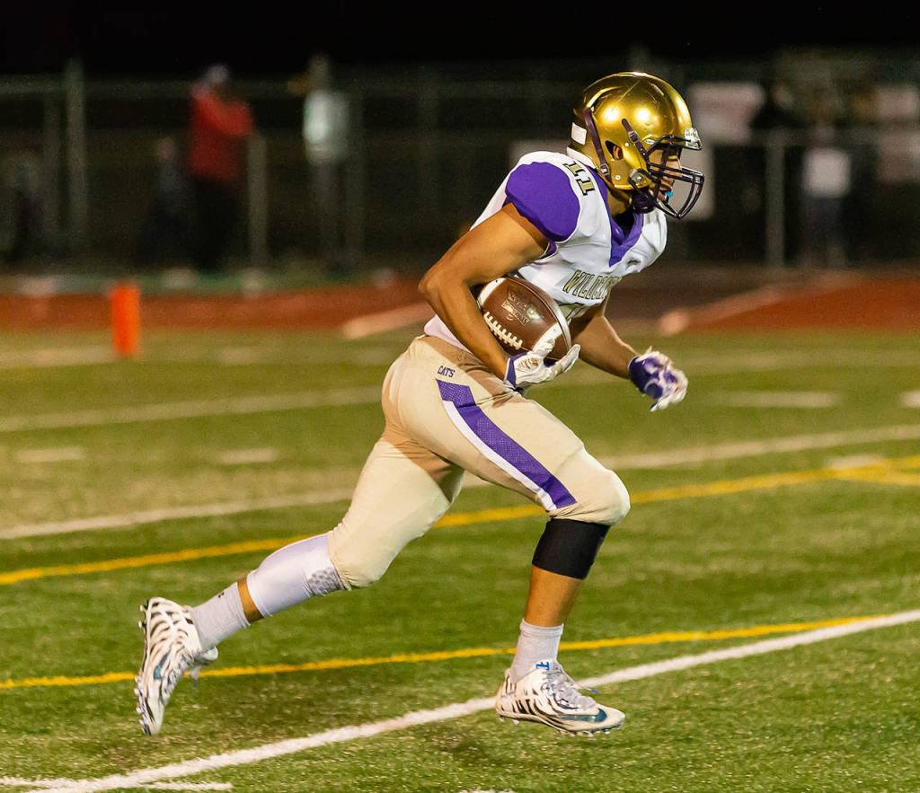 Aaron Martinez returns a kickoff for Oak Harbor.(Photo by John Fisken)