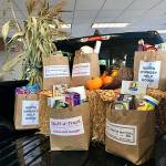 Photo provided.                                Oak Harbor Motors is hosting a Stuff-A-Truck fundraiser throughout November for North Whidbey Help House. The pickup will be driven to the food bank at the end of the month.