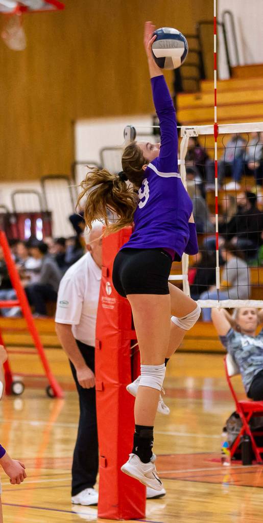 Leielle Salinger blasts a kill for Oak Harbor.(Photo by John Fisken)