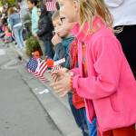 Aislin Smith claps and cheers during Mondays Veterans Day Parade in Oak Harbor. Photo by Laura Guido/Whidbey News-Times