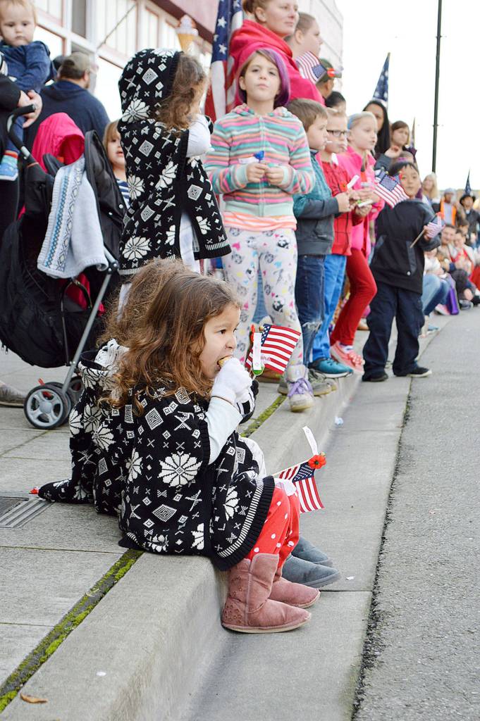 Morwenna Cain enjoys her free ice cream at the Oak Harbor Veterans Day Parade Monday afternoon. Photo by Laura Guido/Whidbey News-Times