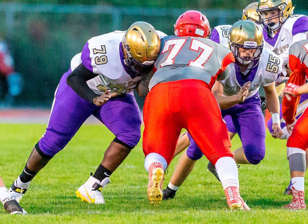 Oak Harbors DeAndre Bennett (79) and Ethan Pace (55) both were named to the all-Wesco North first team in football. (Photo by John Fisken)