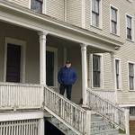 Doug Kroon stands on the porch of the old officers house at Camp Casey where his family once lived