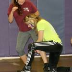 Autumn Coker, right, works on technique with Abigail Correa-Cruz. (Photo by Jim Waller/Whidbey News-Times)