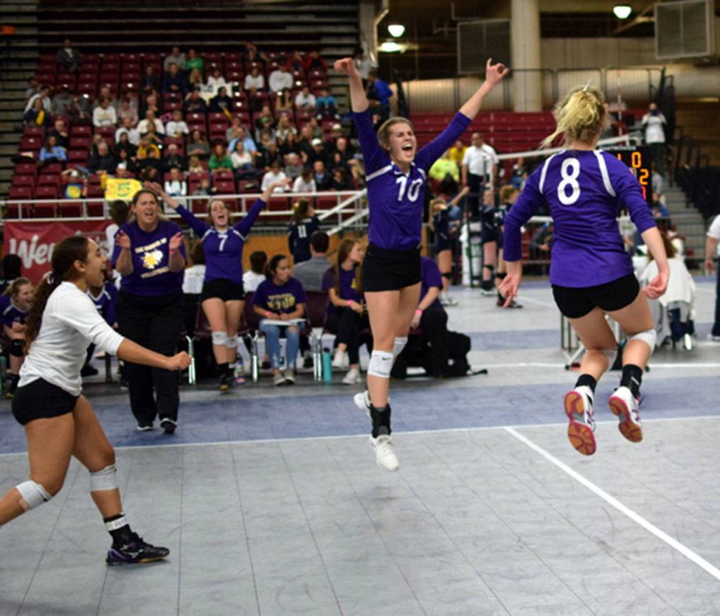 Ceirra Dean, left, coach Kerri Molitor, Annie Salinger (7), Morgan Pease (10) and Cami Bristow (8) celebrate a point against Mountain View.(Photo by Steve Bristow)