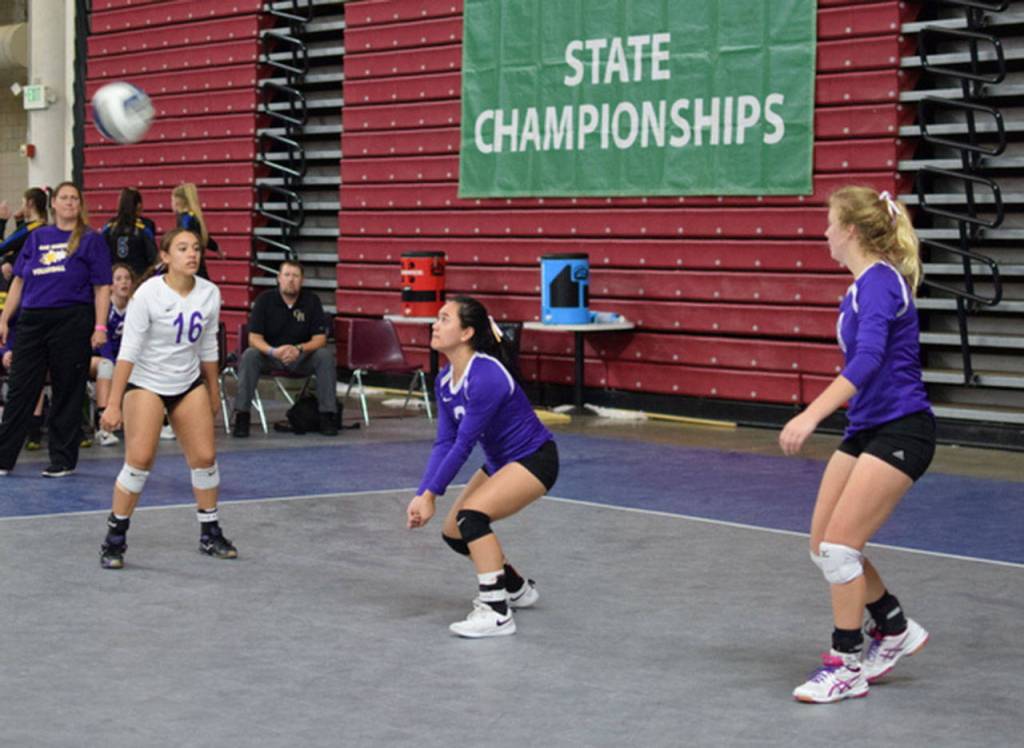 Gredina DeGuzman, center, prepares to receive a Moutain View serve as Ceirra Dean, left, and Cami Bristow look on.(Photo by Steve Bristow)