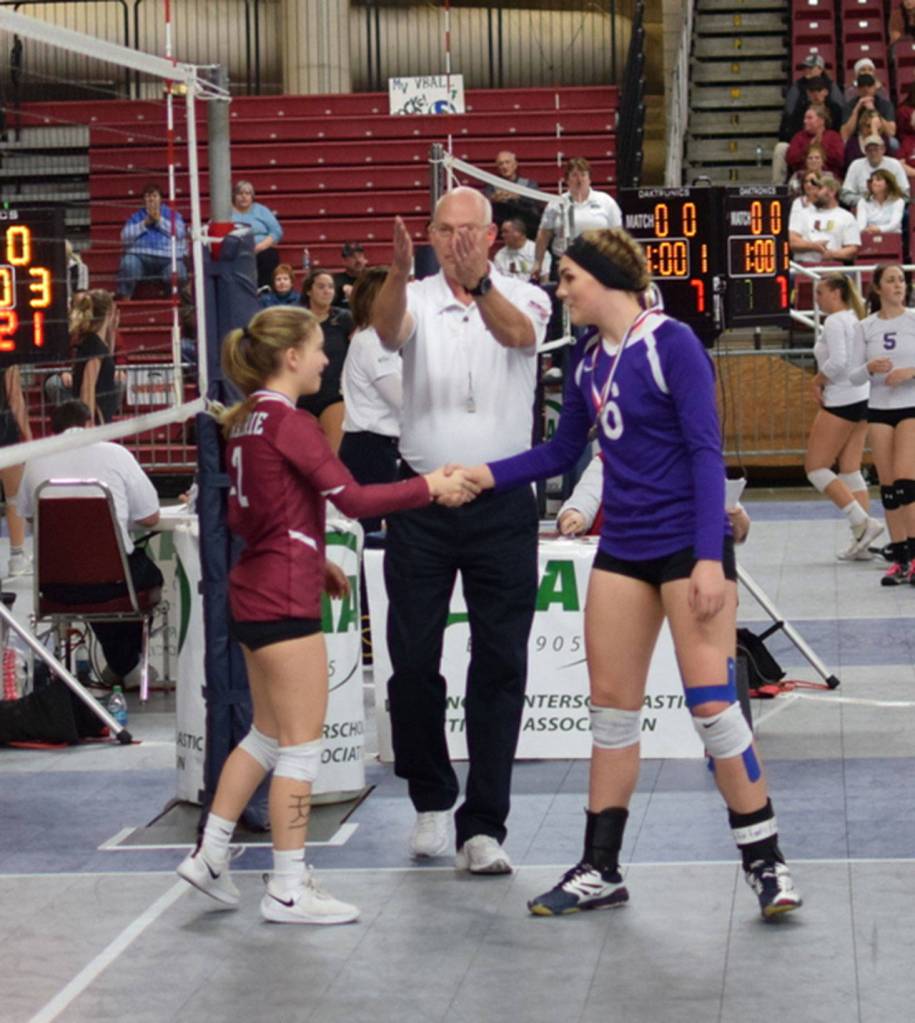 Oak Harbors Payton Parks, right, and Prairies Alissa Fenney are awarded the matchs sportsmanship medals.(Photo by Steve Bristow)