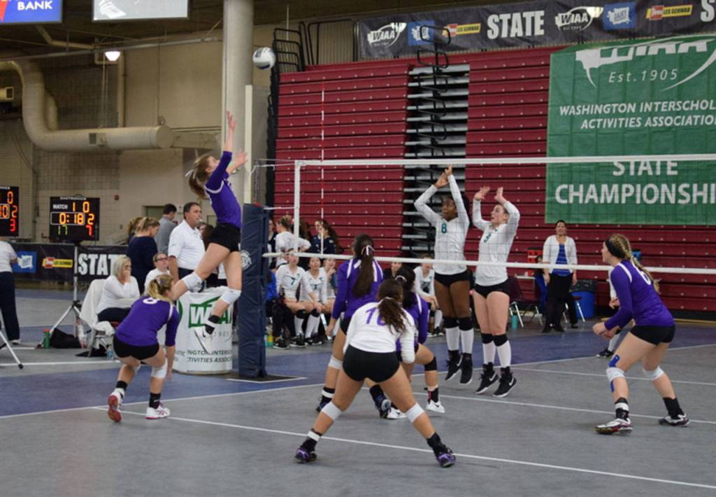 Morgan Pease jumps for a tip in the Mount View match as her teammates cover.(Photo by Steve Bristow)