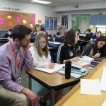 Photo by Maria Matson/Whidbey News-Times.                                Brandon Volkman, seventh- and eighth-grade teacher at Coupeville Middle School, assists students. A new program, Tutorial Time, is helping students to catch up in the classroom.