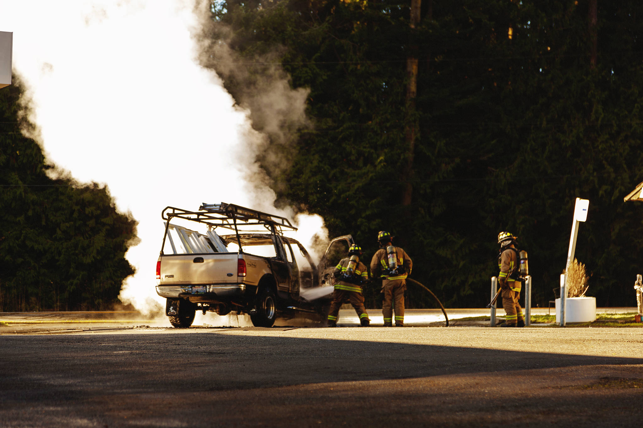 Motorist drives her flaming truck away from gas pumps
