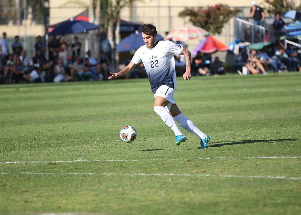 Caley Powers dribbles up field for California Baptist this fall. (Photo courtesy of CBU Athletics)