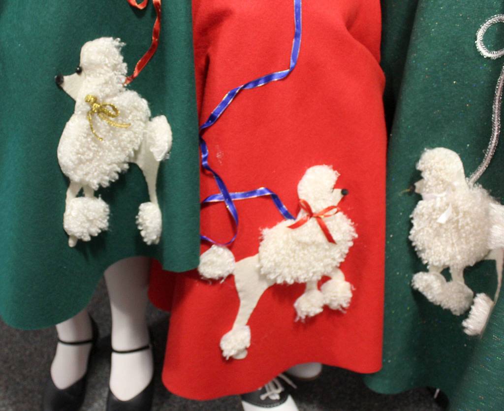 I wanted each poodle and leash to be a different color, said seamtress Kathy Hakes, who made 15 poddle skirts. Its a circular skirt with no seams so really there wasnta lot of sewing involved.