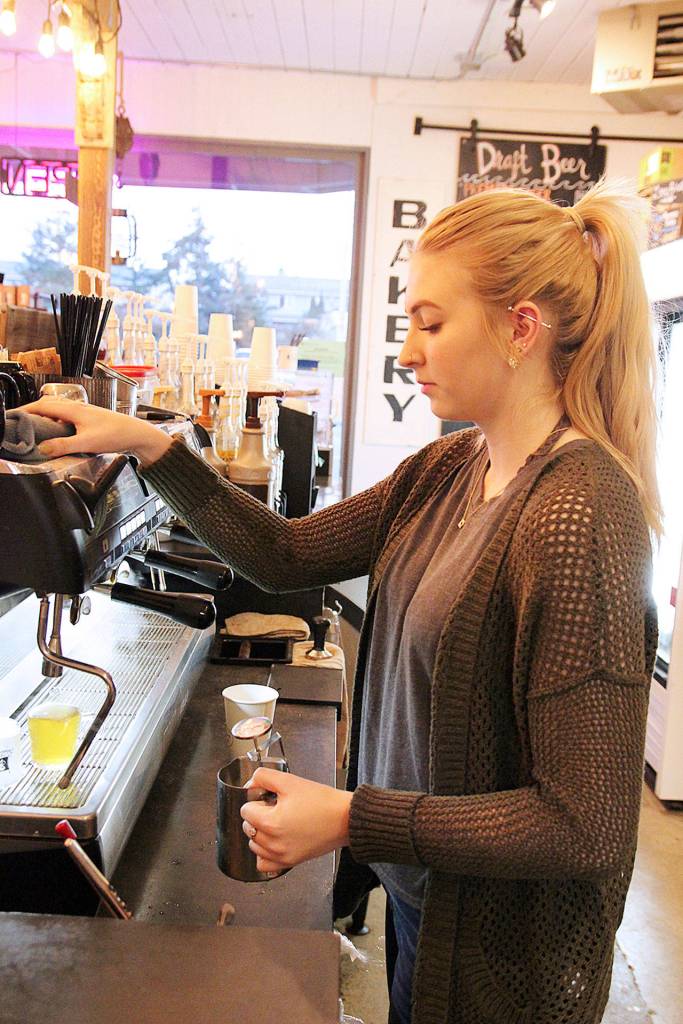 Photo by Laura Guido/Whidbey News-Times.                                Jacklyn Curtis makes a drink at Rock Island Coffee on Midway Boulevard in Oak Harbor.