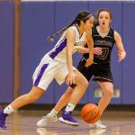 Oak Harbor Mikhaela Cortez dribbles by Lakewoods Riley Mollory. (Photo by John Fisken)