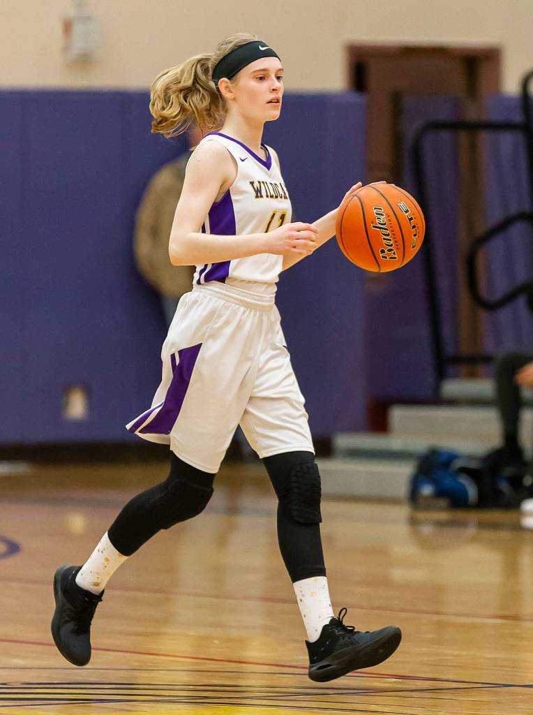 Olivia Waite brings up the ball to get the Oak Harbor offense started. Waite passed for five assists in the game.(Photo by John Fisken)