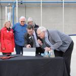 Photo by Jessie Stensland / Whidbey News-Times                                Oak Harbor Mayor Bob Severns and Project Engineer Brett Arvidson, at right, struggle briefly with a computer during the ribbon cutting Thursday for the citys new, state-of-the-art sewage treatment plant. As part of the ceremony, Severns was able to hit a key on the laptop to direct the water cleaned by the plant to go directly into the harbor for the first time. State lawmakers, representatives from the EPA and the state Department of Ecology, a leader from the Swinomish tribal community, the director of the Puget Sound Partnership, city council members and public works staff attended the event in celebration. Severns pointed out that the project came to fruition only with the help from all these partners.