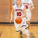 Sean Toomey-Stout races the ball up the court as Koa Davison trails the break.(Photo by John Fisken)