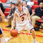 Mason Grove checks out the Bush defense.(Photo by John Fisken)