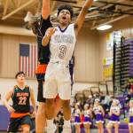 Terrell Crumpton goes to the rim for Oak Harbor.(Photo by John Fisken)