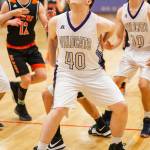 Evan Nadeau (40) blocks out on a rebound.(Photo by John Fisken)