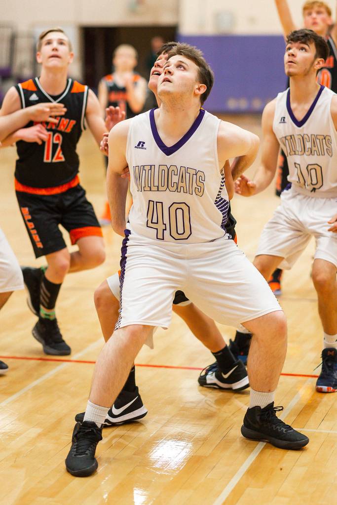 Evan Nadeau (40) blocks out on a rebound.(Photo by John Fisken)
